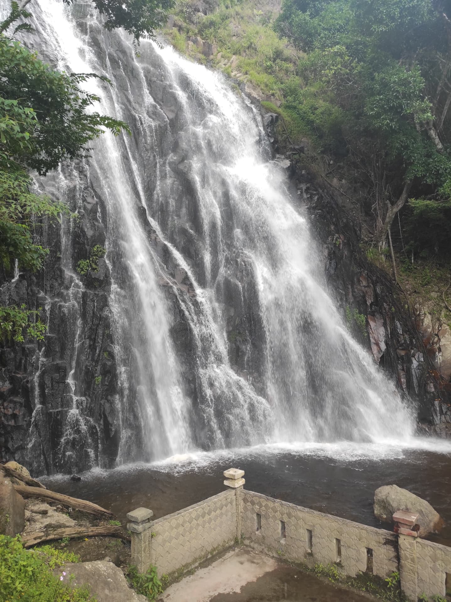 Efrata waterfall cascading down a rocky cliff on Samosir